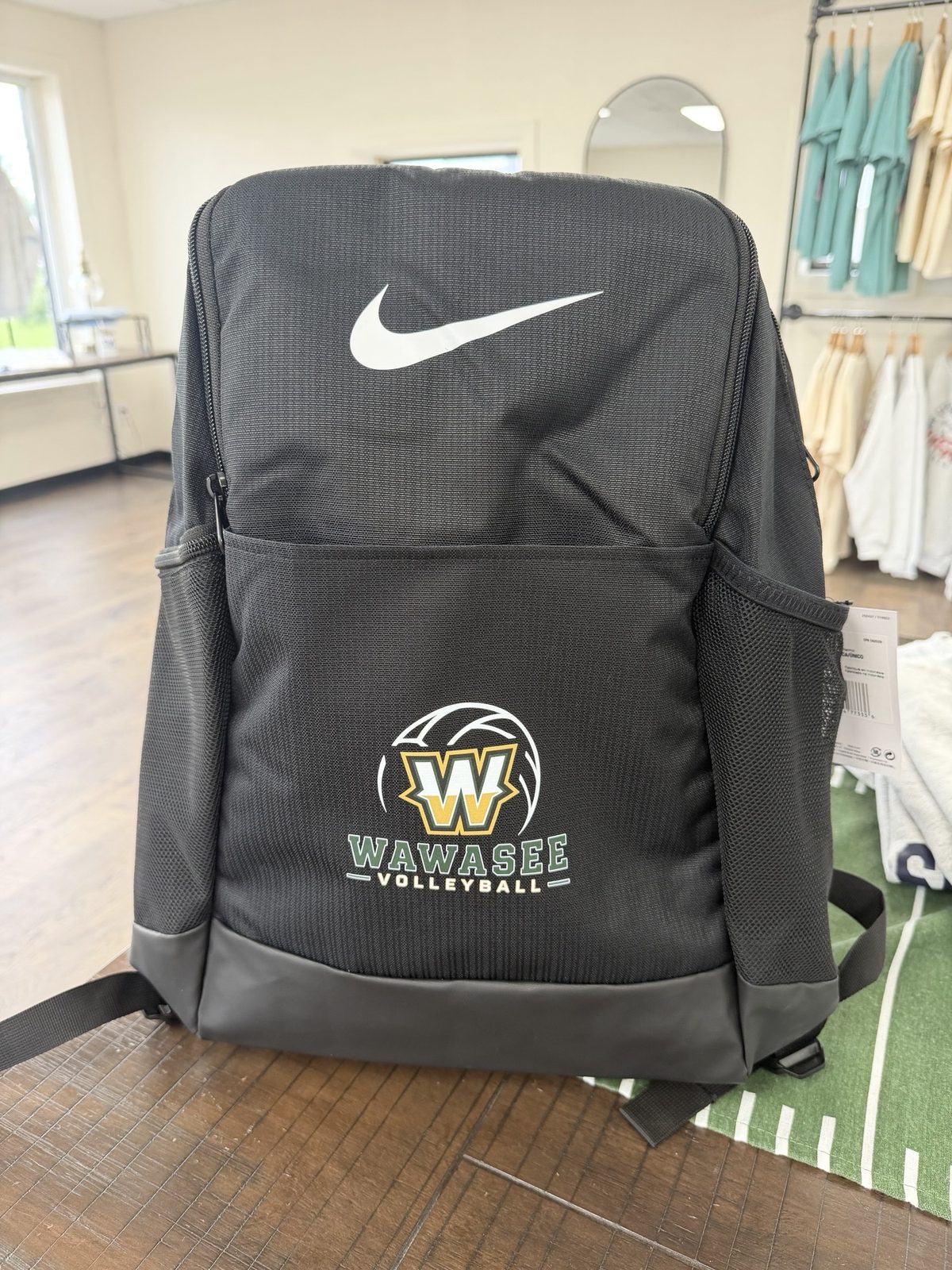 Black Nike backpack decorated with a Wawasee Volleyball logo